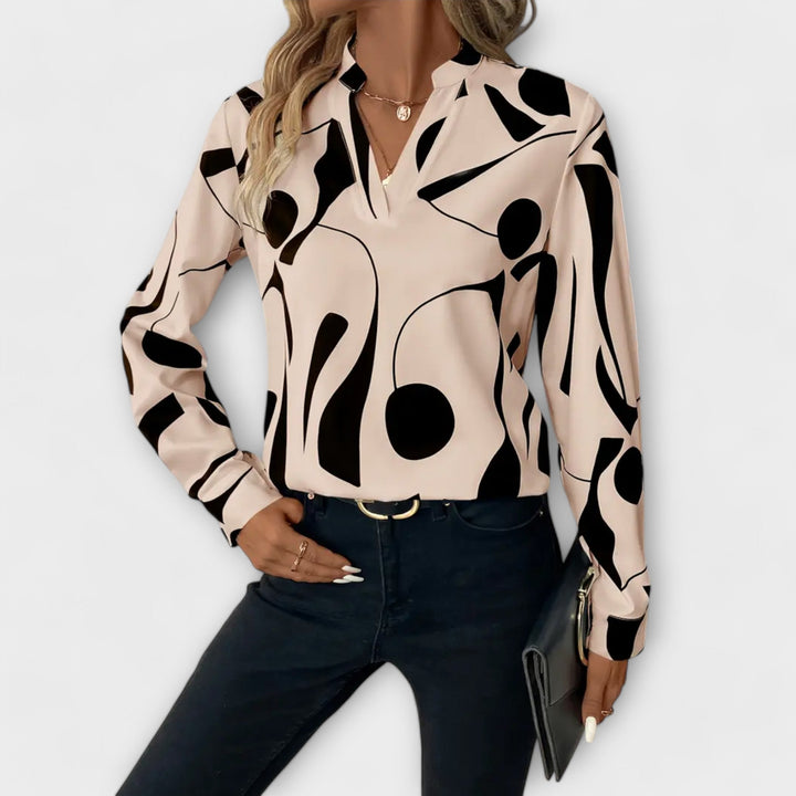 Edith - Blusa blanca y negra con diseño gráfico
