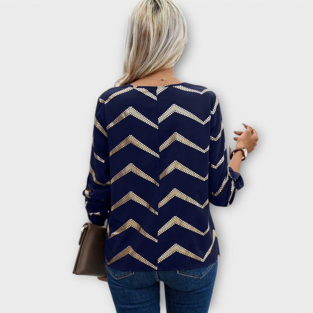Emma - Blusa azul oscuro con diseño de zigzag dorado
