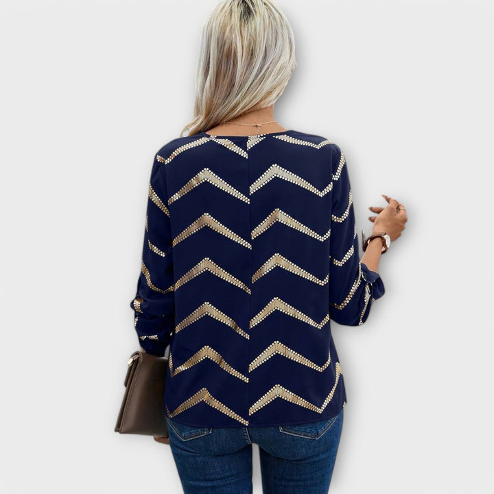Emma - Blusa azul oscuro con diseño de zigzag dorado
