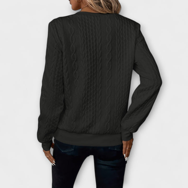 Joy - Jersey elegante de punto con patrón de trenzas