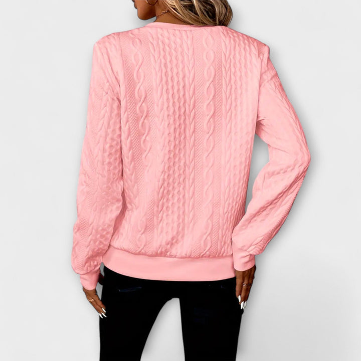 Joy - Jersey elegante de punto con patrón de trenzas