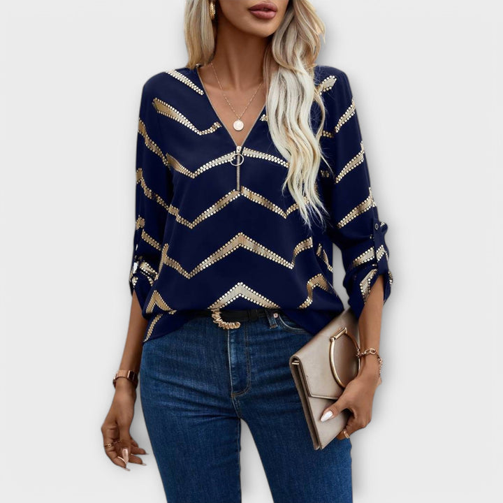 Emma - Blusa azul oscuro con diseño de zigzag dorado
