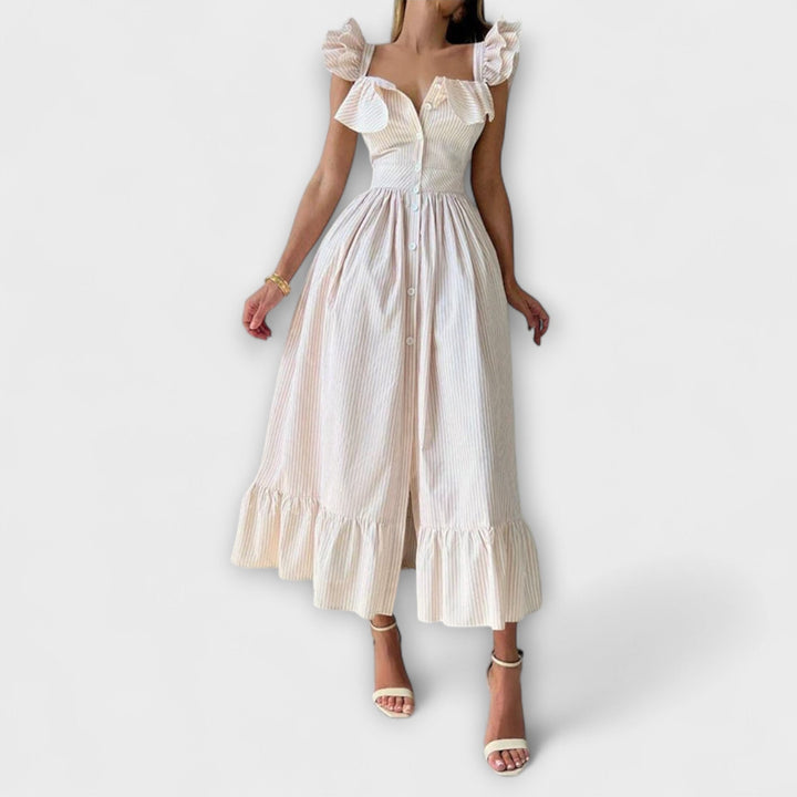 Lia - Vestido maxí de volantes en color crema