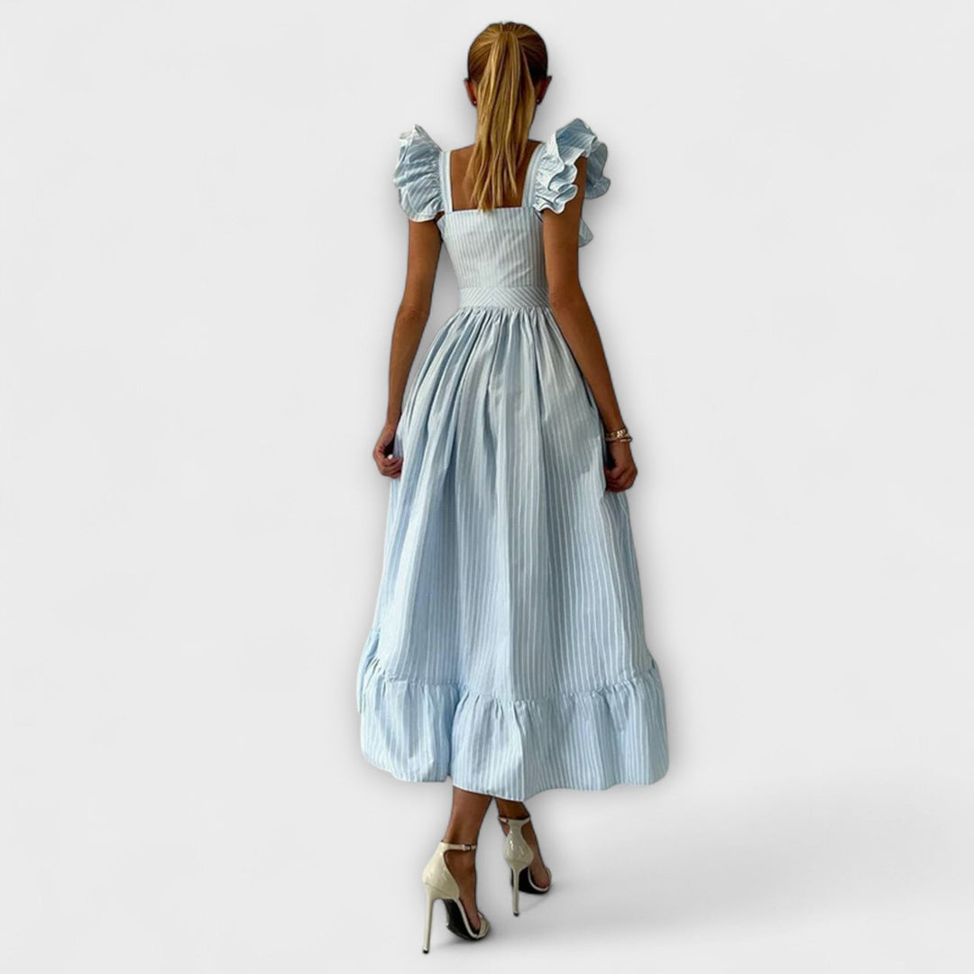 Lia - Vestido maxí de volantes en color crema