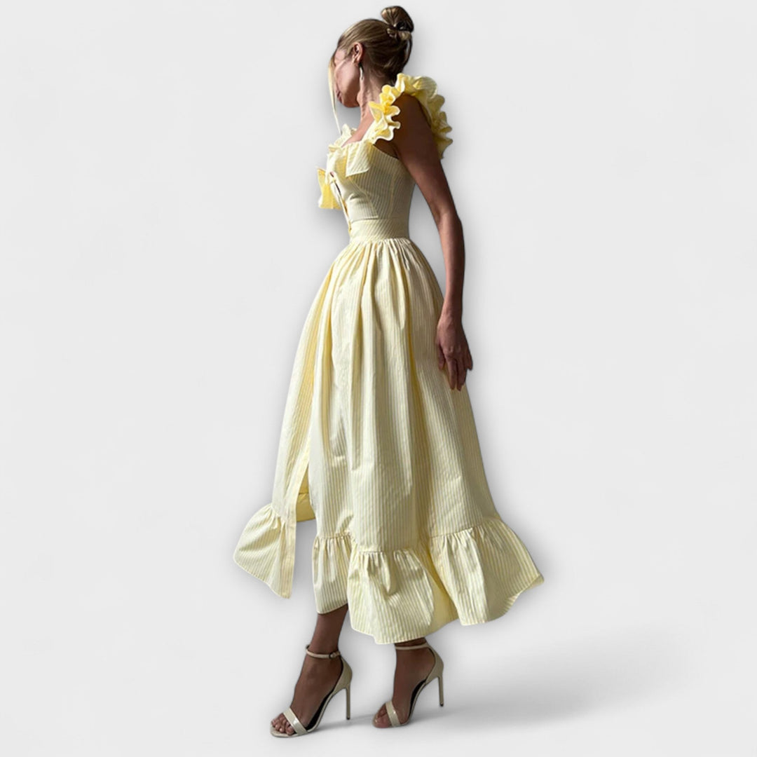 Lia - Vestido maxí de volantes en color crema