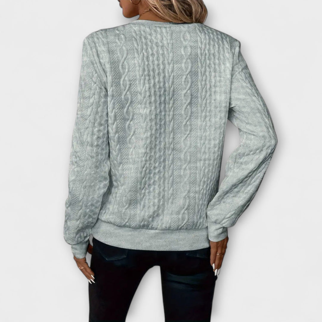 Joy - Jersey elegante de punto con patrón de trenzas
