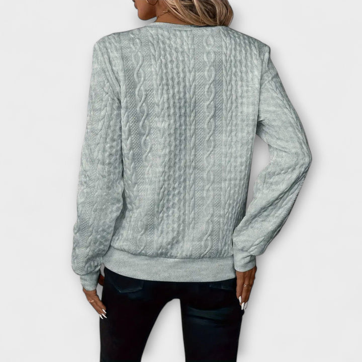 Joy - Jersey elegante de punto con patrón de trenzas