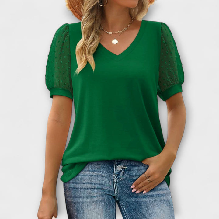 Rema - Top blanco con escote en V y mangas transparentes
