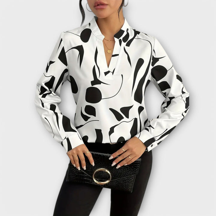 Edith - Blusa blanca y negra con diseño gráfico