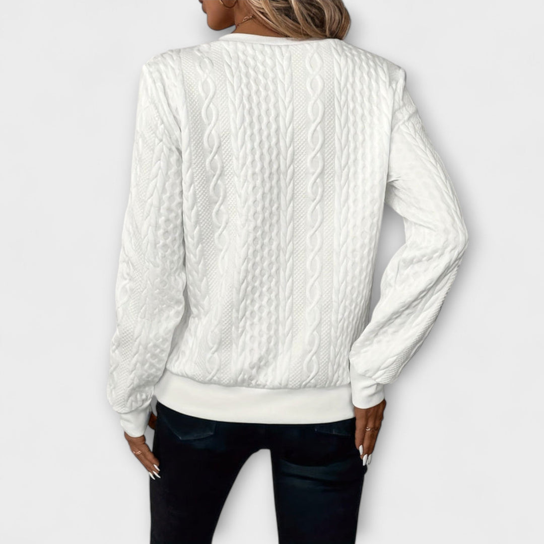 Joy - Jersey elegante de punto con patrón de trenzas