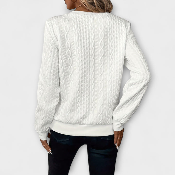 Joy - Jersey elegante de punto con patrón de trenzas
