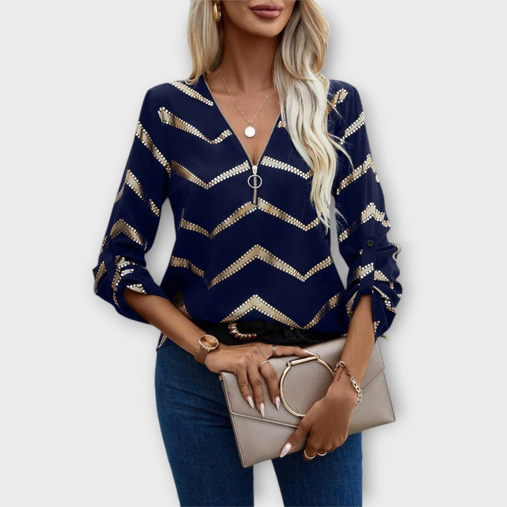 Emma - Blusa azul oscuro con diseño de zigzag dorado