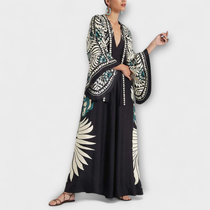 Giselle - Vestido maxi negro con estampado de hojas